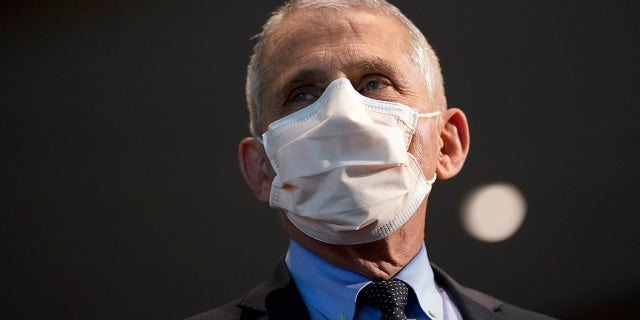 FILE - In this Dec. 22, 2020, file photo, Dr. Anthony Fauci, director of the National Institute of Allergy and Infectious Diseases, speaks before receiving his first dose of the COVID-19 vaccine at the National Institutes of Health, in Bethesda, Md. Fauci’s quick commitment to the WHO — whose response to the pandemic has been criticized by many, but perhaps most vociferously by the Trump administration — marks a dramatic and vocal shift toward a more cooperative approach to fighting the pandemic. (AP Photo/Patrick Semansky, Pool, File)