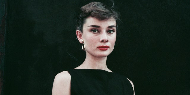 Belgian-born actress Audrey Hepburn (1929 - 1993) in a black sleeveless dress, circa 1955. 