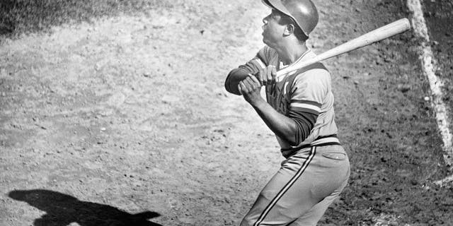 Milwaukee Brewers' Hank Aaron watches the flight of a hit off Boston Red Sox pitcher Bill Lee. The Boston Red Sox hosted the Milwaukee Brewers in a regular season MLB baseball game at Fenway Park in Boston on Sep. 14, 1975. 