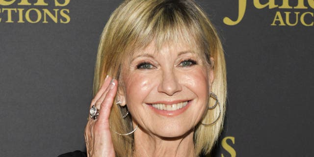 Olivia Newton-John reflected on how she ‘freaked out’ of the lyrics in her hit song ‘Physical’ after she recorded it.