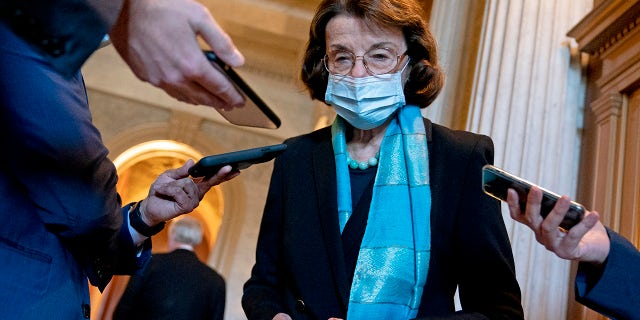 U.S. Sen. Dianne Feinstein (D-CA) wears a protective mask while speaking to reporters at the U.S. Capitol on December 11, 2020 in Washington, DC. (Photo by Stefani Reynolds/Getty Images)