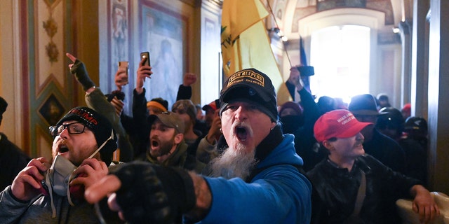 Supporters of U.S. President Donald Trump demonstrate inside the U.S. Capitol on January 6, 2021 in Washington, DC.  (Photo by ROBERTO SCHMIDT / AFP via Getty Images)