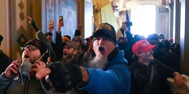 Supporters of U.S. President Donald Trump demonstrate inside the U.S. Capitol on January 6, 2021 in Washington, DC.  (Photo by ROBERTO SCHMIDT / AFP via Getty Images)