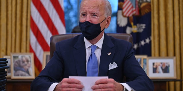 US President Joe Biden is preparing to sign a series of orders in the Oval Office of the White House in Washington, DC, after being sworn in at the US Capitol on January 20, 2021.  The party leaders in the Senate are struggling to reach a power-sharing agreement, something that could harm Biden's agenda if it is not dealt with quickly.  (Photo by Jim WATSON / AFP) (Photo by JIM WATSON / AFP via Getty Images)