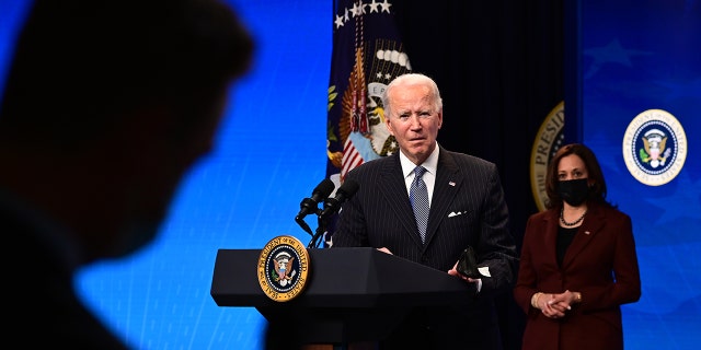 President Joe Biden with Vice President Kamala Harris answers questions from the media after signing a "Made in America" Executive Order in the South Court Auditorium at the White House on January 25, 2021, in Washington, D.C. (Photo by JIM WATSON/AFP via Getty Images)