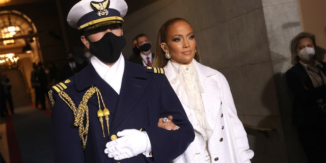 Jennifer Lopez is escorted to the inauguration of U.S. President-elect Joe Biden on the Western Front of the U.S. Capitol on January 20, 2021 in Washington, DC (Getty Images)