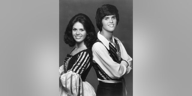 Portrait of sibling singers Donny and Marie Osmond, 1975.