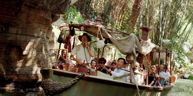 A photo of a tour group on the Jungle Cruise in Disneyland.