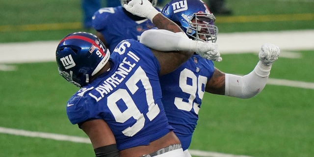 New York Giants' Leonard Williams, right, celebrates a sack with Dexter Lawrence (97) during the second half of an NFL football game against the Dallas Cowboys, Sunday, Jan. 3, 2021, in East Rutherford, N.J.