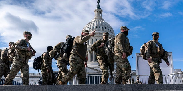 National Guardsmen reinforce security around the U.S. Capitol ahead of the inauguration of President-elect Joe Biden and Vice President-elect Kamala Harris, Sunday, Jan. 17, 2021, in Washington. (AP Photo/J. Scott Applewhite)