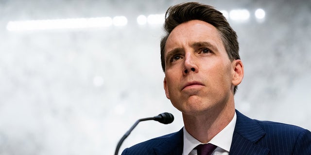 U.S. Senator Josh Hawley (R-MO) listens as Supreme Court candidate Justice Amy Coney Barrett testifies before the Senate Judiciary Committee on the second day of his Supreme Court confirmation hearing on Capitol Hill on October 13 2020 in Washington, DC.  Hawley said Wednesday he is bringing forward an amendment to oppose government funding for school districts that do not bring children into classrooms.  (Anna Moneymaker-Pool / Getty Images)