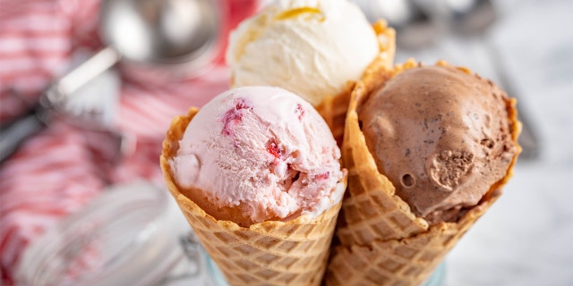 Strawberry, vanilla and chocolate ice cream waffle cones are shown here.