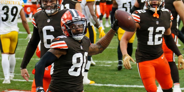 Cleveland Browns wide receiver Jarvis Landry (80) celebrates after scoring a 3-yard touchdown during the second half of an NFL football game against the Pittsburgh Steelers, Sunday, Jan. 3, 2021, in Cleveland. (AP Photo/Ron Schwane)