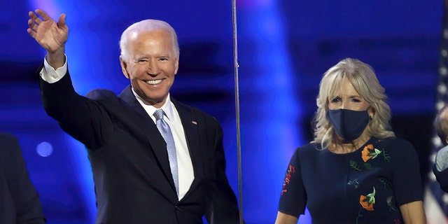 WILMINGTON, DELAWARE - NOVEMBER 07:  President-elect Joe Biden and Jill Biden wave to the crowd on November 07, 2020 in Wilmington, Delaware. (Photo by Tasos Katopodis/Getty Images)