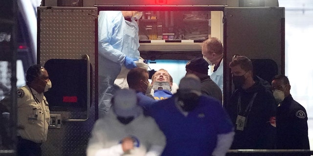 Los Angeles Rams quarterback John Wolford leans back after walking into an ambulance parked in a tunnel just off the field during the first half of an NFL wild-card playoff football game against the Seattle Seahawks, Saturday, Jan. 9, 2021, in Seattle. (AP Photo/Ted S. Warren)