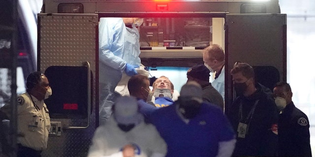 Los Angeles Rams quarterback John Wolford leans back after walking into an ambulance parked in a tunnel just off the field during the first half of an NFL wild-card playoff football game against the Seattle Seahawks, Saturday, Jan. 9, 2021, in Seattle. (AP Photo/Ted S. Warren)