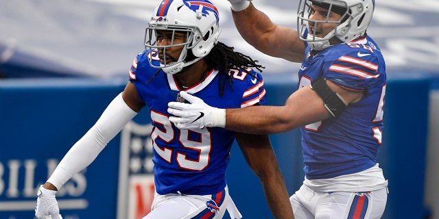 Buffalo Bills cornerback Josh Norman (29) celebrates his touchdown with outside linebacker Matt Milano (58) in the second half of an NFL football game against the Miami Dolphins, Sunday, Jan. 3, 2021, in Orchard Park, N.Y. (AP Photo/Adrian Kraus)