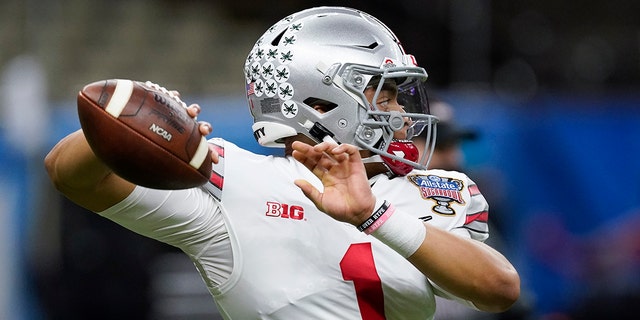 Ohio State quarterback Justin Fields warms up before the Sugar Bowl NCAA college football game against Clemson Friday, Jan. 1, 2021, in New Orleans. (Associated Press)