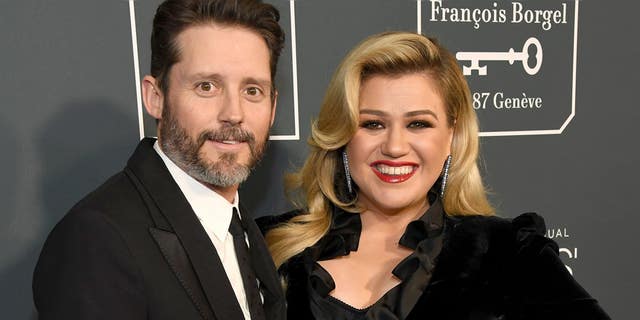 Kelly Clarkson (right) is in the process of divorcing her husband Brandon Blackstock (left).