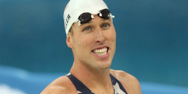 US swimmer Klete Keller smiles after winning the men's 4 x 200m freestyle relay swimming heat at the National Aquatics Center in the 2008 Beijing Olympic Games. Keller was reportedly seen among a crowd of rioters who stormed the U.S. Capitol last week. (AFP PHOTO / GREG WOOD)