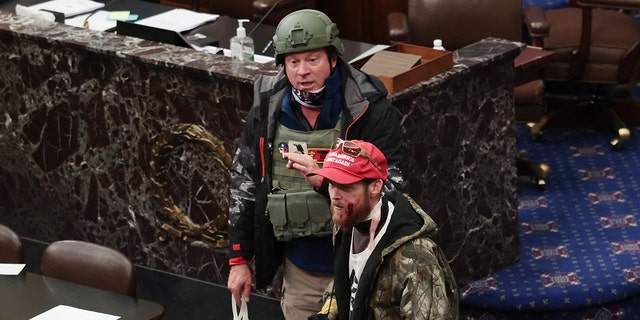Larry Brock Jr. has been identified wearing a helmet on the Senate floor as pro-Trump rioters stormed the U.S. Capitol building Wednesday after mass demonstrations. (Photo by Win McNamee/Getty Images)