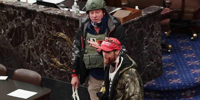 Larry Brock Jr. has been identified wearing a helmet on the Senate floor as pro-Trump rioters stormed the U.S. Capitol building Wednesday after mass demonstrations. (Photo by Win McNamee/Getty Images)