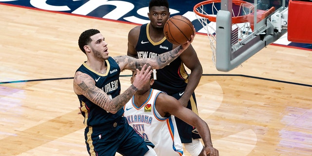 New Orleans Pelicans guard Lonzo Ball (2) shoots past Oklahoma City Thunder center Al Horford (42) in the fourth quarter of an NBA basketball game in New Orleans, Wednesday, Jan. 6, 2021. (AP Photo/Derick Hingle)