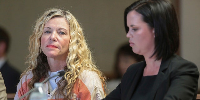 Lori Vallow takes a look at a camera during her March 6, 2020 hearing in Rexburg, Idaho.  To his right is defense lawyer Edwina Elcox. 