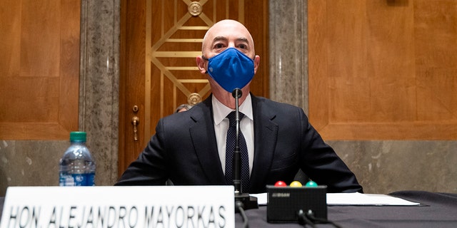 Homeland Security Secretary candidate Alejandro Mayorkas takes his seat to testify during his confirmation hearing at the Senate Homeland Security and Government Affairs Committee on Tuesday, January 19, 2021, on Capitol Hill in Washington.  (Bill Clark / Pool via AP)
