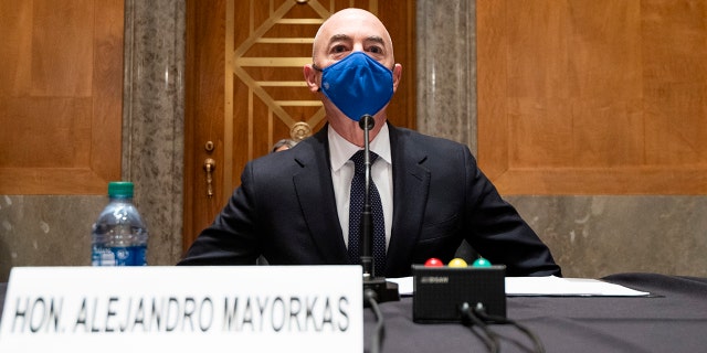 Homeland Security Secretary nominee Alejandro Mayorkas takes his seat to testify during his confirmation hearing in the Senate Homeland Security and Governmental Affairs Committee on Tuesday, Jan. 19, 2021, on Capitol Hill in Washington. (Bill Clark/Pool via AP)
