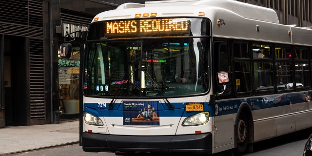An MTA bus displays the message 'Masks Required' as New York City continues reopening efforts following restrictions imposed to slow the spread of coronavirus. (Photo by Noam Galai/Getty Images)