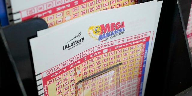 Forms for the Mega Millions lottery at a local grocery store on January 12, 2021 in Des Moines, Iowa.  (AP Photo / Charlie Neibergall)