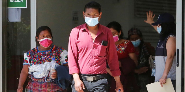 Members of Guatemalan Maya families, who feared their relatives were among 19 bodies found shot and burnt at the weekend in a remote part of northern Mexico along a route popular with migrant smugglers heading toward the U.S. border, leave the Faculty of Medicine after taking DNA samples to help in the identification, in Guatemala City, Guatemala on Jan. 25, 2021.