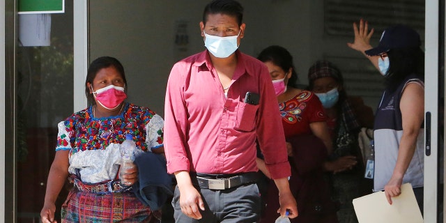 Members of Guatemalan Maya families, who feared their relatives were among 19 bodies found shot and burnt at the weekend in a remote part of northern Mexico along a route popular with migrant smugglers heading toward the U.S. border, leave the Faculty of Medicine after taking DNA samples to help in the identification, in Guatemala City, Guatemala on Jan. 25, 2021.