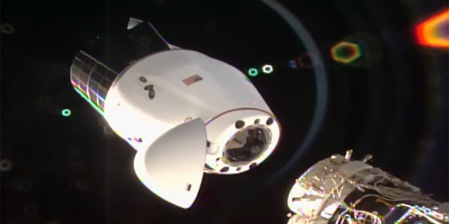 SpaceX's Cargo Dragon spacecraft begins its undocking from the International Space Station.