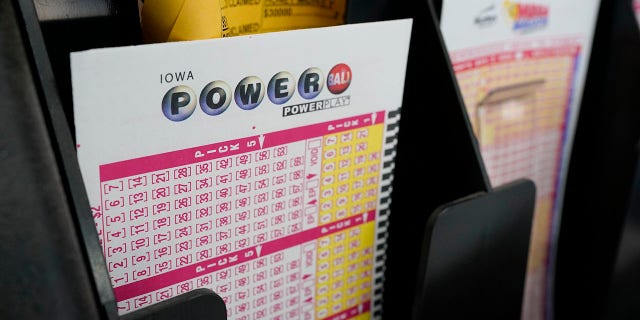 The Powerball jackpot has grown to $640 million ahead of its next drawing Saturday, while the Mega Millions jackpot has soared to $750 million ahead of Friday night's drawing. (AP Photo/Charlie Neibergall)