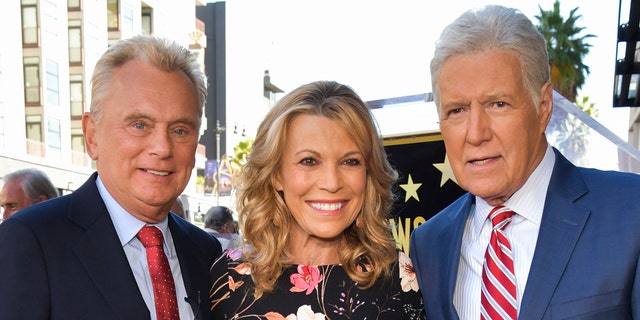 'Wheel of Fortune' hosts Pat Sajak (left) and Vanna White (center) open about their 'admiration' for 'Jeopardy!  'host Alex Trebek (right) after his death.  (Photo by Rodin Eckenroth / WireImage)