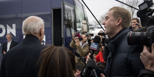 Peter Doocy, a Fox News reporter, tries to ask former vice president Joe Biden a question, which is ignored, as Biden exits a campaign event at Jeno's Little Hungary in Davenport, Iowa, on Jan. 28, 2020. (Carolyn Van Houten/The Washington Post via Getty Images) 