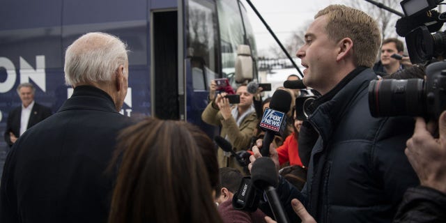 Peter Doocy, a Fox News reporter, tries to ask former vice president Joe Biden a question, which is ignored, as Biden exits a campaign event at Jeno's Little Hungary in Davenport, Iowa, on Jan. 28, 2020. (Carolyn Van Houten/The Washington Post via Getty Images)