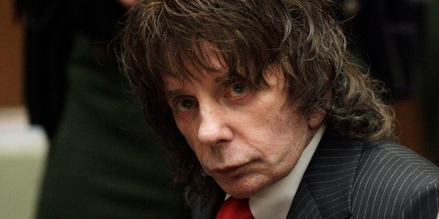 In this May 29, 2009 photo, music producer Phil Spector sits in a courtroom for his sentencing in Los Angeles. Spector, the eccentric and revolutionary music producer who transformed rock music with his "Wall of Sound" method and who was later convicted of murder, died on Jan. 16, 2021, at age 81.  