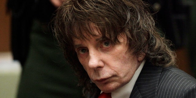 In this May 29, 2009 file photo, music producer Phil Spector sits in a Los Angeles sentencing courtroom.  Spector, the eccentric and revolutionary music producer who transformed rock music with his "Wall of sound" method and who was later convicted of murder, died Saturday, January 16, 2021, at the age of 81.