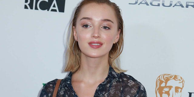 Phoebe Dynevor said she had to 'fast forward' through steamy 'Bridgerton' scenes while watching with her family. (Photo by Leon Bennett/FilmMagic)