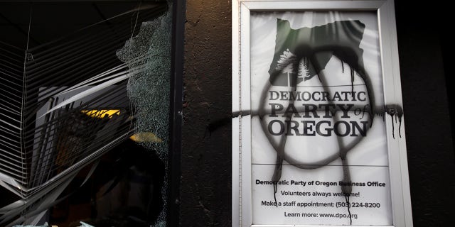 Democratic Party of Oregon headquarters is vandalized during a protest after the inauguration of U.S. President Joe Biden, in Portland, Oregon, U.S. January 20, 2021. REUTERS/Lindsey Wasson