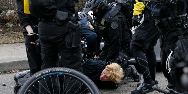 Black Block, anarchists, and antifascist activists opposed to Joe Biden marched and demonstrated in Portland, Oregon on Inauguration Day, January 20 2021, resulting in a few broken windows and eight arrests. (Photo by John Rudoff/Sipa USA)