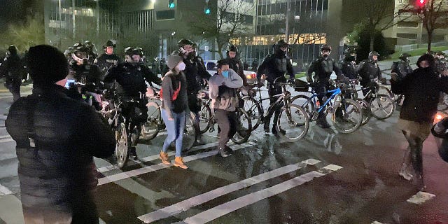 After a short standoff, the Tacoma Police advanced on the mob, ordering them to disperse. Not everyone took them seriously as some mocked them with a dance as they were pushed out of the intersection.