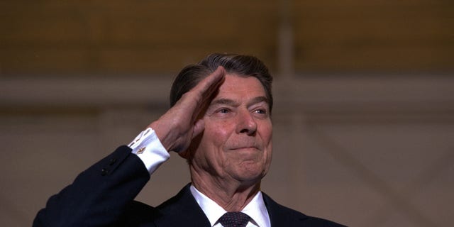 Former U.S. President Ronald Reagan is shown saluting in 1989.  (AP Photo)