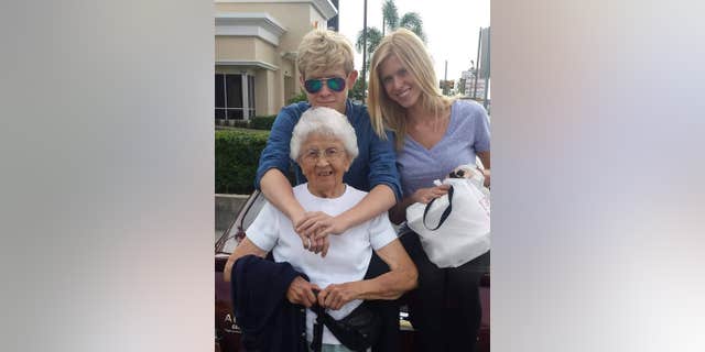 Rita Thomas (center) pictured with her grandson, Thomas McInnes (left), and granddaughter Cat McInnes (right) (Photo courtesy of the Thomas family).