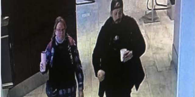 Police say this photo shows Lisa Eisenhart and Eric Munchel leaving a Grand Hyatt hotel "shortly before the start of the joint session of Congress and a little over an hour afterwards, before the barricades on the Capitol were passed."