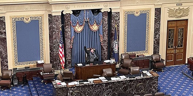 At least one protester reached the dais on the Senate floor, where he reportedly shouted, "Trump won that election."