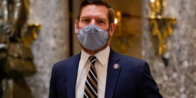 Impeachment manager Rep. Eric Swalwell, D-Calif., walks on Capitol Hill in Washington, Wednesday, Jan. 13, 2021. (AP Photo/Susan Walsh)